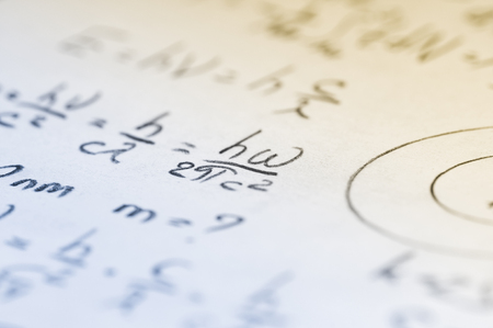 sheet of paper filled with calculations of nuclear and quantum physics as a backgroundの写真素材