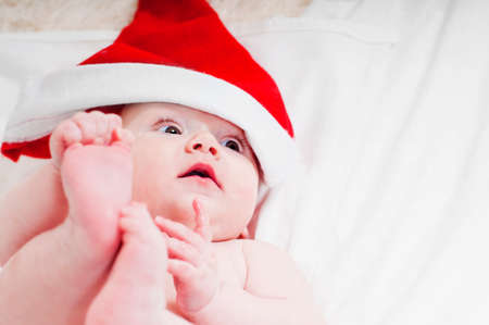 Cute little newborn santa babyの写真素材