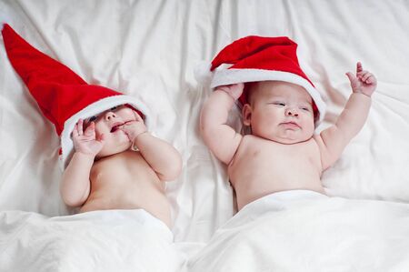 Two cute newborn Santa