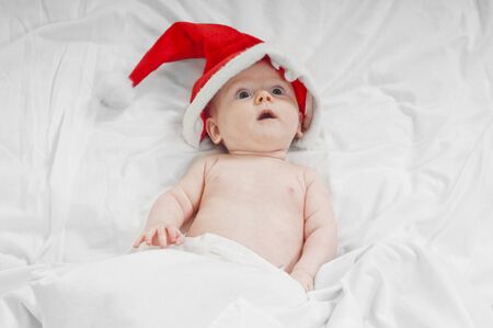 Cute little newborn santa babyの写真素材