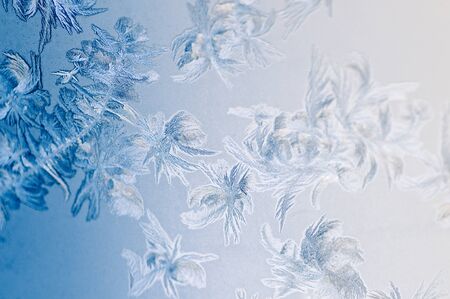 Frosty winter background photo of ice buildup on a window