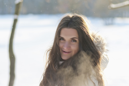 Beautiful girl in the winter parkの写真素材
