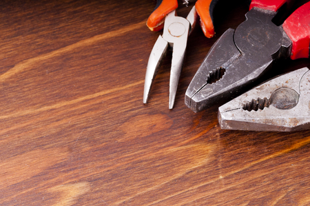 Pliers and tongs on the tableの写真素材