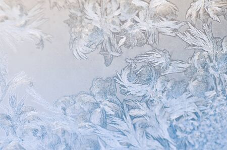 Frosty winter background photo of ice buildup on a window