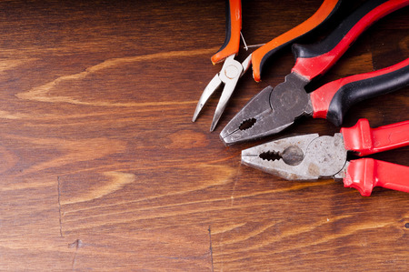 Pliers and tongs on the table