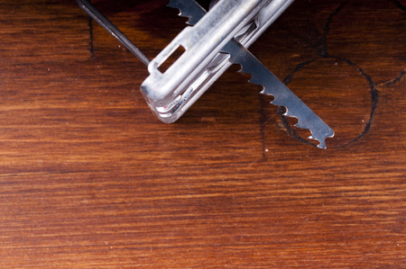 Electric jigsaw on the table
