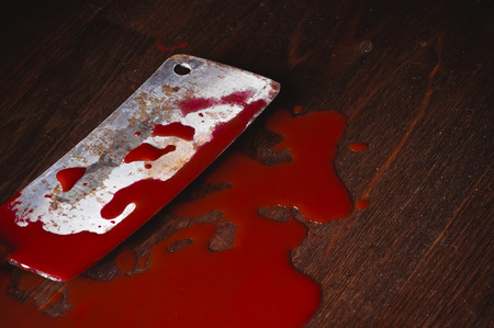 A puddle of blood and rusty knife. Murder.の写真素材
