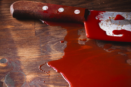 A puddle of blood and rusty knife. Murder.の写真素材
