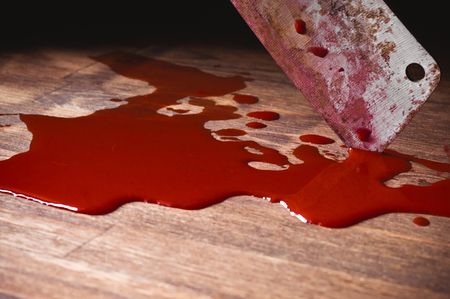 A puddle of blood and rusty knife. Murder.の写真素材