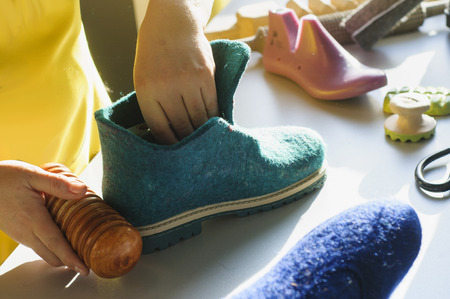 Handmade shoes. The process of making fashionable and stylish shoes from natural felted wool.の写真素材