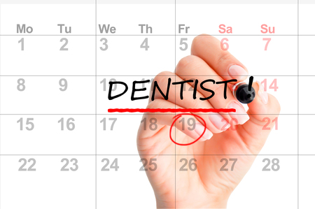 Dentist appointment reminder on calendar plannerの写真素材
