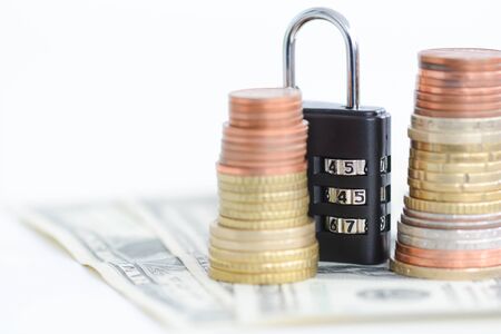 Saving protection concept with money and combination lockの写真素材