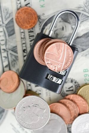 Saving protection concept with money and combination lockの写真素材