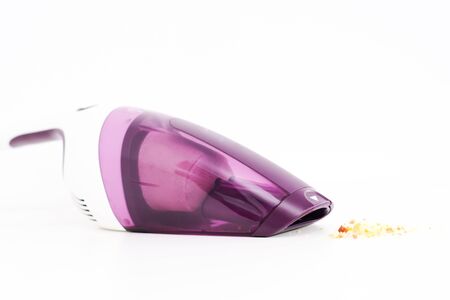Purple hand held vacuum cleaner isolated on white backgroundの写真素材