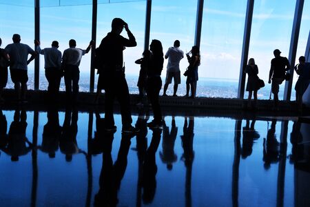 Backlit Silhouettes, People Looking at View from One World Trade Center Observatory, Manhattan New York Cityの写真素材