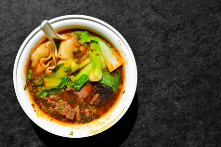 Traditional Thai beef soup or stew in a bowlの写真素材