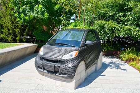 Rubber car sculpture on The High Line with an apple tree sprouting from its roofの写真素材
