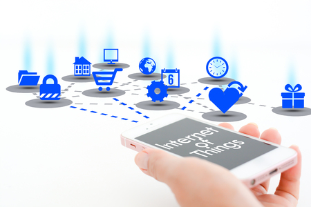 Internet of things concept with smartphone and different apps iconsの写真素材