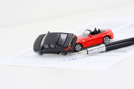 Toy cars accident damage and insurance policy contractの写真素材