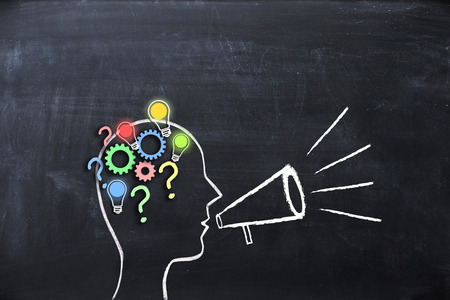 Share your knowledge concept with human head shape on blackboardの写真素材