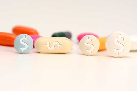 Healthcare cost concept with multicolored medical drugs with us dollar symbolの写真素材