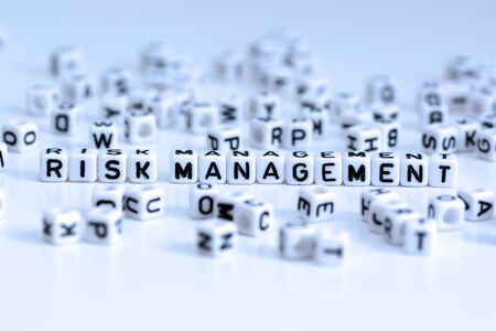 Risk management text from white tiled lettersの写真素材