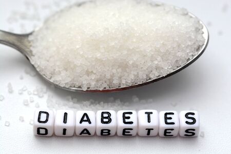 Diabetes word from letter blocks with spoon and sugarの写真素材