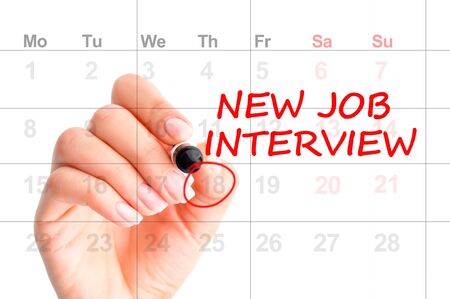 New job interview reminder on calendar with marked dateの写真素材