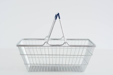 Metal Shopping basket isolated on white backgroundの写真素材