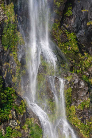 A small waterfall at Milford Sound, New Zealandの写真素材