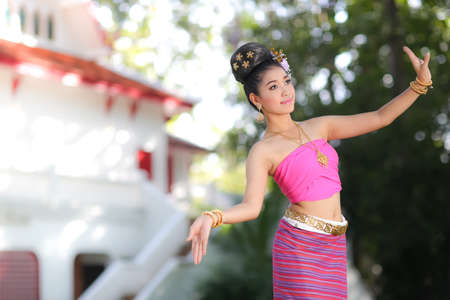Thai dancing girl with northern style dress in temple, Chiang Mai, Thailandの写真素材