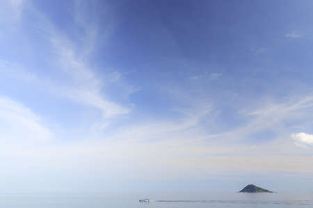 Boat travelling on the sea with island background, Koh Tao, Samui, Thailandの写真素材