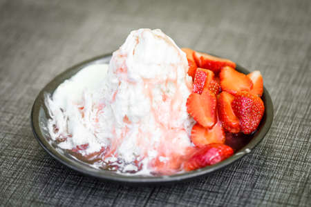 Pieces of strawberry and caramel topping iceflake