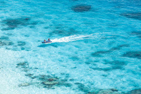 Speed boat in crystal clear tropical sea, Similan island, Thailandの写真素材