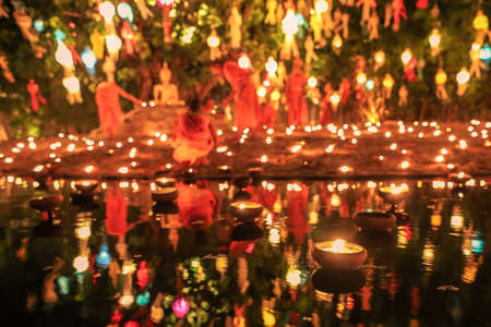 Floating candle with monk and buddha image in Thai temple ,Loy Krathong Festival, Chiang Mai, Thailandの写真素材
