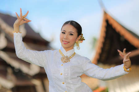 Thai dancing girl with northern style dress in temple, Chiang Mai, Thailandの写真素材