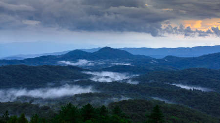 Foggy tropical mountain ranges after raining, Inthanon, Chiang Mai, Thailandの写真素材