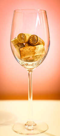 Corks in a wine glass, close up, backgroundの写真素材