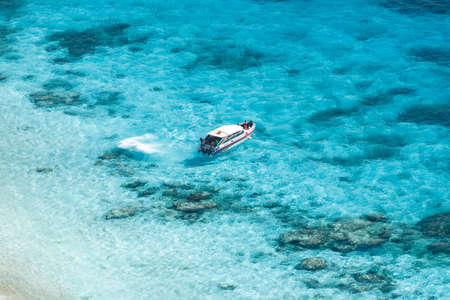 Speed boat in crystal clear tropical sea, Similan island, Thailandの写真素材