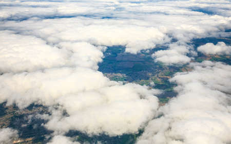 Aerial view of city through airplane windowの写真素材