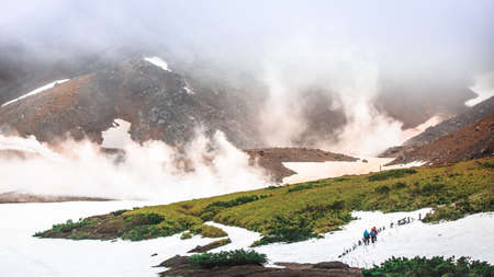 Trekking trail on snow covered volcano, Asahidake, Daisetsusan national park, Hokkaido, Japanの写真素材