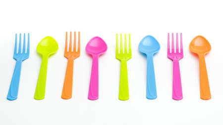 Colorful fork and spoon on isolated white background