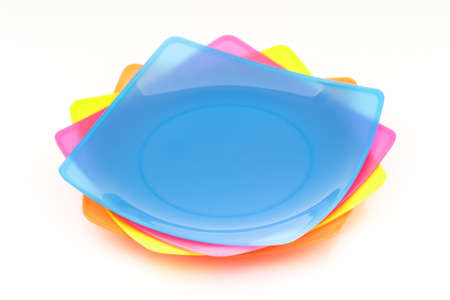 Colorful stack plastic dish on isolated white backgroundの写真素材