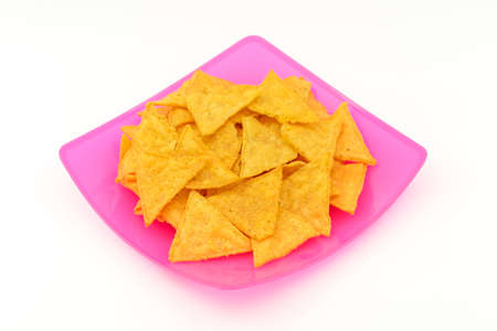 Tortilla chips in plastic dish on isolated white backgroundの写真素材