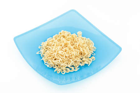 Noodles in colorful dish on isolated white backgroundの写真素材