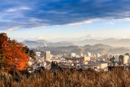 Takayama city with Japan alps (snow mountain range) background, Japanの写真素材