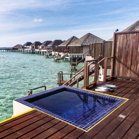 Pool at balcony with water villas background, Maldivesのeditorial素材