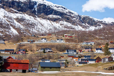 Nordic house in small town with ice cap mountain background,  Norwayの写真素材
