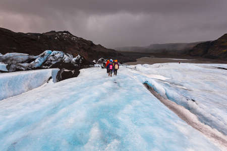 Group of hiker walk on glacier on Solheimajokull, Icelandの写真素材