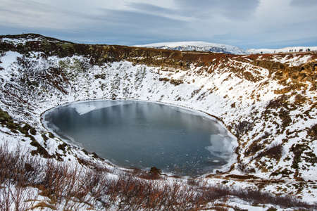 Volcanic crator in winter under cloudy sky, Icelandの写真素材